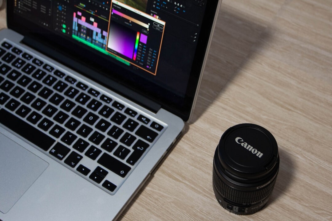 filmmaker editing video on laptop