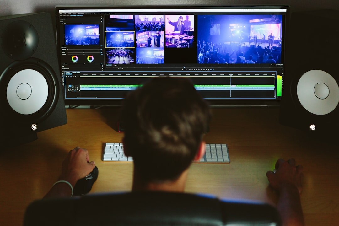 video editor adjusting colors on monitor